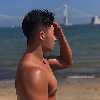 Asian cute boy in the beach